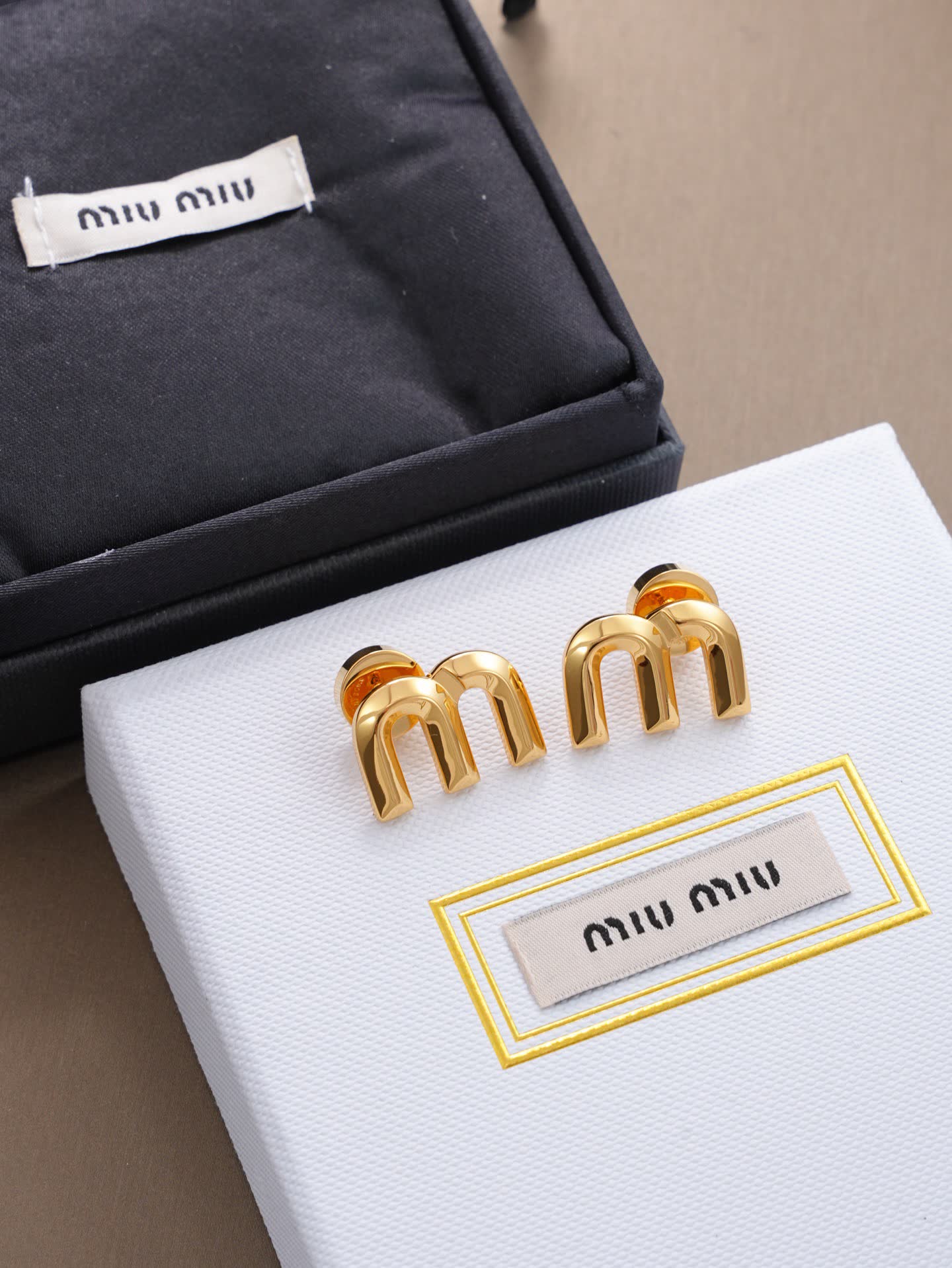Miu Miu Gold Tone 'M' Stud Earrings